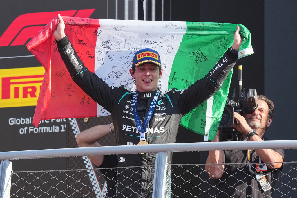 Mercedes driver Andrea Kimi Antonelli of Italy celebrates on the podium after winning the Italian Formula One Grand Prix race, in Monza, Italy, Sunday, Sept. 6, 2026. (AP Photo/Antonio Calanni)