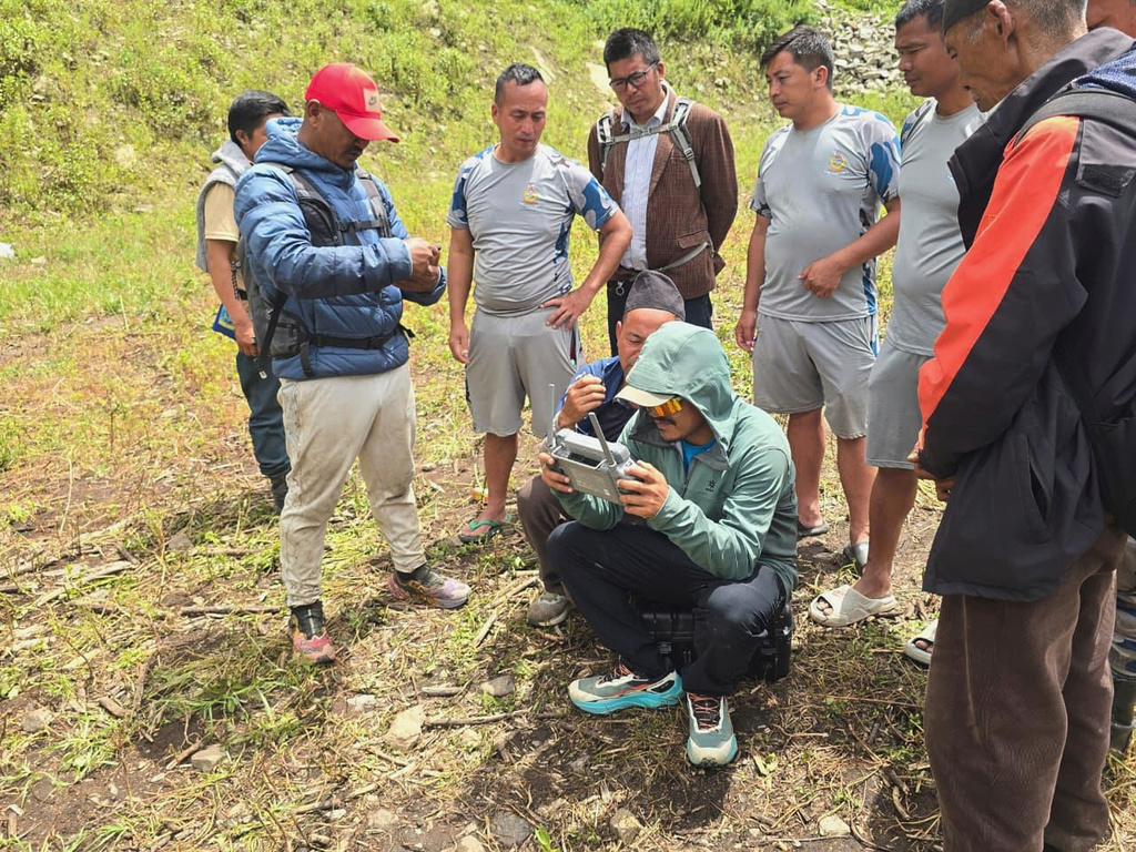In this image provided by Manish Maharjan, filmmaker and drone pilot Manish Maharjan operates a drone at the Rashuwaghadi hydropower project in Rasuwa district, Nepal, Monday, Aug. 31, 2026. (Manish Maharjan via AP)