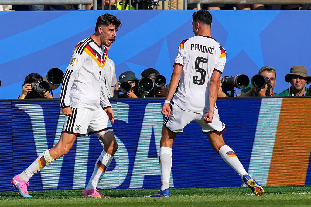 Germany's Kai Havertz (7) celebrates after scoring his side's opening goal with teammate Aleksandar Pavlovic (5) during the World Cup round of 32 soccer match between Germany and Paraguay in Foxborough, Mass., near Boston, Monday, June 29, 2026. (AP Photo/Martin Meissner)
