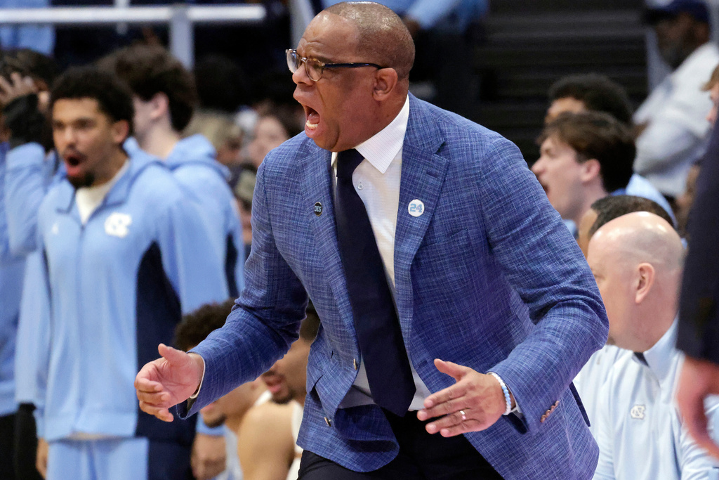 North Carolina head coach Hubert Davis yells directions to the team during the first half of an NCAA college basketball game against Virginia Tech, Saturday, Feb. 28, 2026, in Chapel Hill, N.C. (AP Photo/Chris Seward)