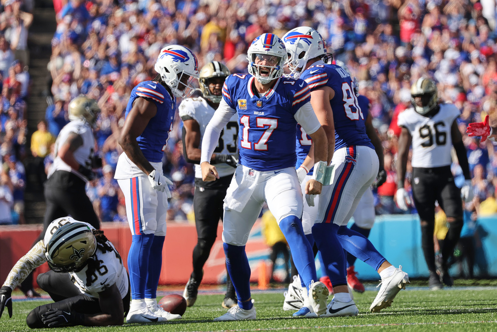 Buffalo Bills quarterback Josh Allen (17) celebrates a first down carry in the second half of an NFL football game against the New Orleans Saints, Sunday, Sept. 28, 2025, in Orchard Park, N.Y. (AP Photo/Jeffrey T. Barnes)