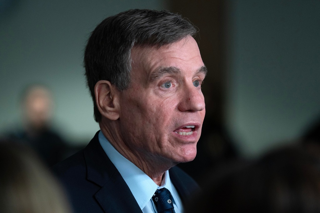 Senate Intelligence Committee Vice Chairman Sen. Mark Warner, D-Va., speaks with reporters after the Senate Committee on Intelligence hearings on Capitol Hill Wednesday, March 18, 2026, in Washington. (AP Photo/Jose Luis Magana)