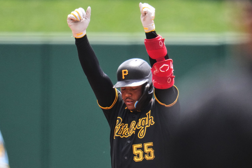 Pittsburgh Pirates' Esmerlyn Valdez celebrates as he stands on second base after hitting a double off Milwaukee Brewers pitcher Robert Gasser in the first inning of a baseball game in Pittsburgh, Sunday, July 12, 2026. (AP Photo/Gene J. Puskar)