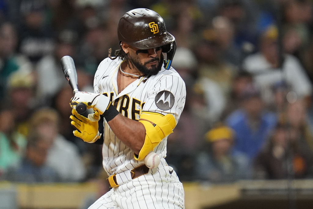 San Diego Padres' Fernando Tatis Jr. is hit by a pitch while batting during the seventh inning of a baseball game against the Seattle Mariners Thursday, April 16, 2026, in San Diego. (AP Photo/Gregory Bull)