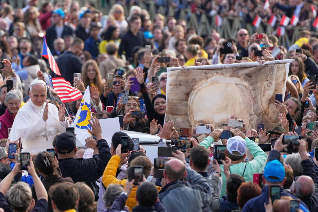 FILE - Pope Leo XIV greets faithful during the weekly general audience in St. Peter's Square, at the Vatican, Oct. 29, 2025. (AP Photo/Gregorio Borgia, File)