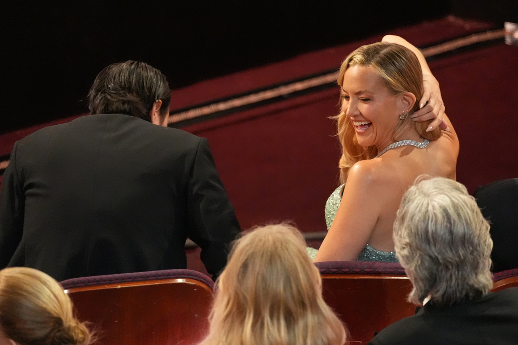 Danny Fujikawa, left, and Kate Hudson in the audience during the Oscars on Sunday, March 15, 2026, at the Dolby Theatre in Los Angeles. (AP Photo/Chris Pizzello)