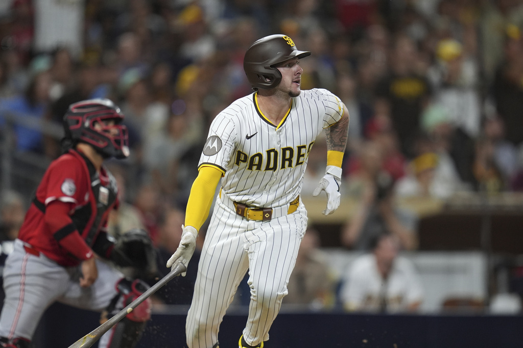 San Diego Padres' Jackson Merrill watches his two-RBI triple during the sixth inning of a baseball game against the Cincinnati Reds Monday, Sept. 8, 2025, in San Diego. (AP Photo/Gregory Bull)