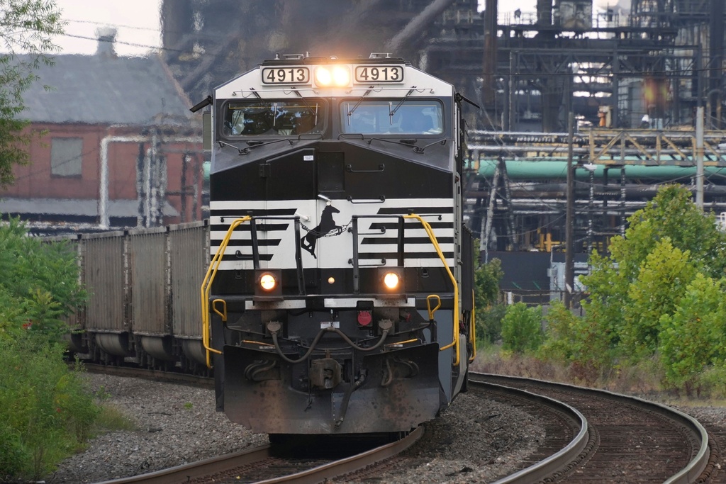 FILE - A Norfolk Southern freight train rolls past the U.S. Steel's Clairton Coke Works, in Clairton, Pa., Aug. 12, 2025. (AP Photo/Gene J. Puskar, File)