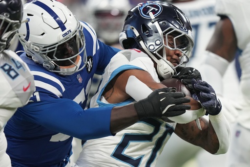 Tennessee Titans running back Tony Pollard (20) is tackled by Indianapolis Colts defensive end Kwity Paye (51) during the first half an NFL football game, Sunday, Oct. 26, 2025, in Indianapolis. (AP Photo/AJ Mast) Tennessee Titans running back Tony Pollard (20) is tackled by Indianapolis Colts defensive end Kwity Paye (51) during the first half an NFL football game, Sunday, Oct. 26, 2025, in Indianapolis. (AP Photo/AJ Mast)