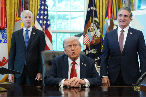 President Donald Trump speaks to reporters before signing an executive order in the Oval Office at the White House, Monday, Oct. 6, 2025, in Washington, as Energy Secretary Chris Wright and Interior Secretary Doug Burgum listen. (AP Photo/Jacquelyn Martin) President Donald Trump speaks to reporters before signing an executive order in the Oval Office at the White House, Monday, Oct. 6, 2025, in Washington, as Energy Secretary Chris Wright and Interior Secretary Doug Burgum listen. (AP Photo/Jacquelyn Martin)