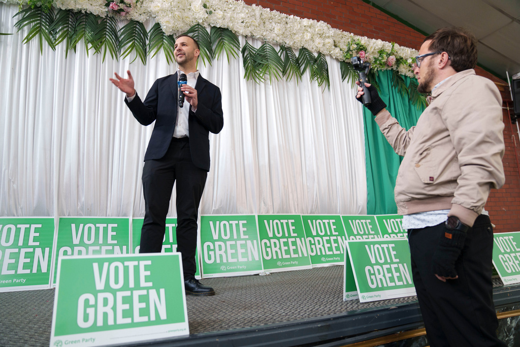 Green Party leader Zack Polanski speaks as candidate for the Gorton and Denton by-election Hannah Spencer is announced in Manchester, England, Friday, Jan. 30, 2026. (AP Photo/Jon Super)