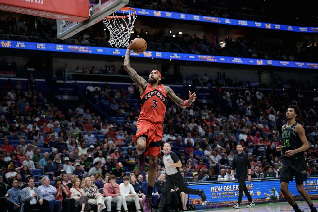 Toronto Raptors forward Brandon Ingram (3) dunks after breaking away with steal next to New Orleans Pelicans forward Trey Murphy III (25) during the first half of an NBA basketball game in New Orleans, Wednesday, March 11, 2026. (AP Photo/Matthew Hinton)