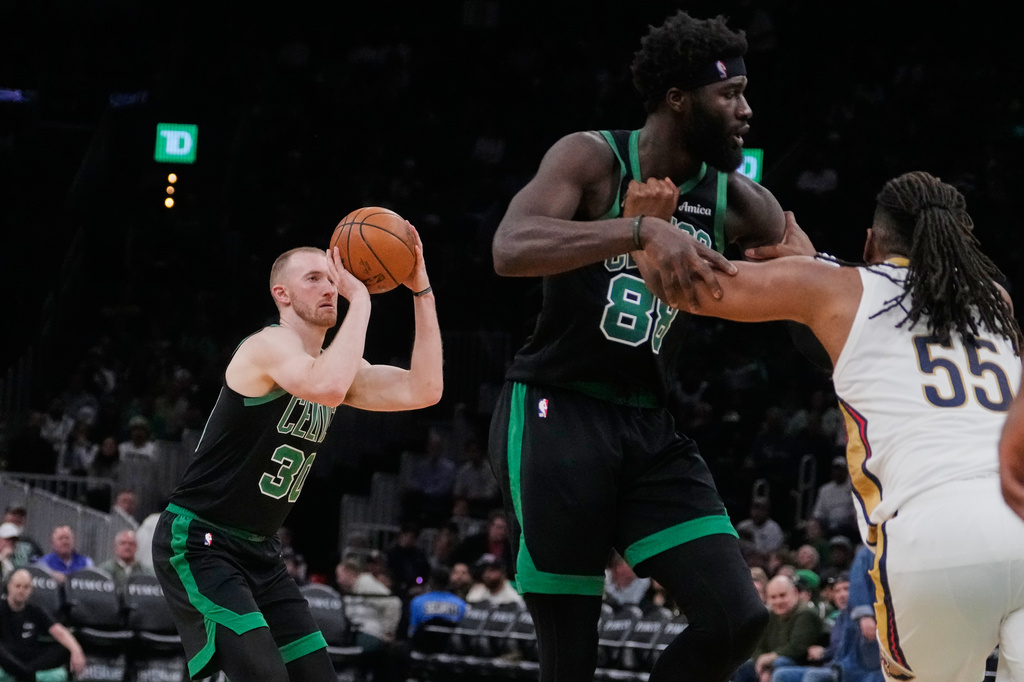 Boston Celtics forward Sam Hauser (30) takes a 3-point shot against the New Orleans Pelicans during the second half of an NBA basketball game, Friday, April 10, 2026, in Boston. (AP Photo/Charles Krupa)
