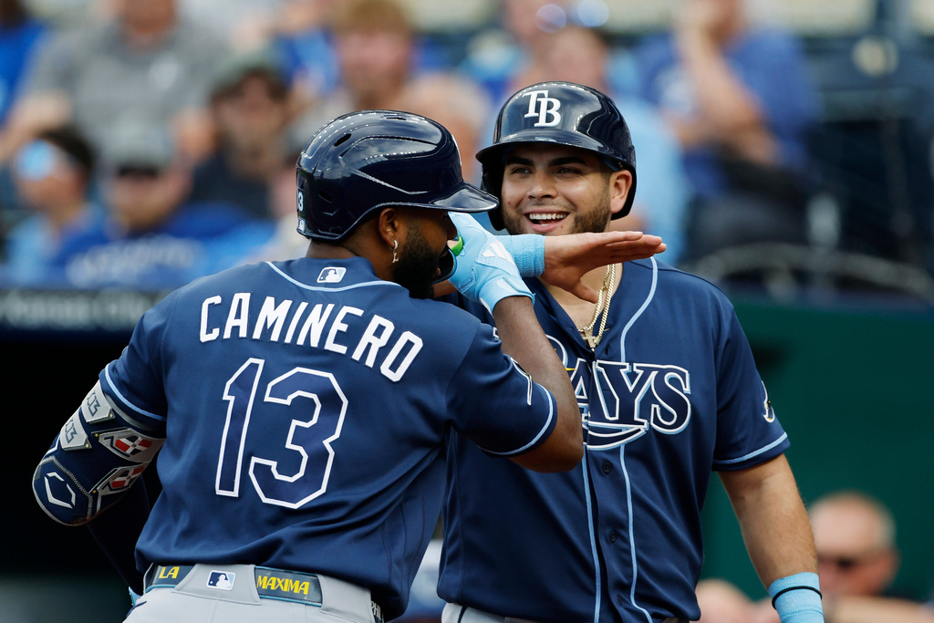 Tampa Bay Rays' Junior Caminero (13) celebrates his two-run home run with Jonathan Aranda, right, during the first inning of a baseball game against the Kansas City Royals in Kansas City, Mo., Wednesday, July 1, 2026. (AP Photo/Colin E. Braley)