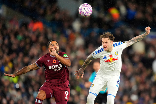 West Ham United's Callum Wilson, left, and Leeds United's Joe Rodon in action during the English Premier League soccer match between Leeds United and West Ham United at Elland Road, Leeds, England, Friday Oct. 24, 2025. (Danny Lawson/PA via AP) West Ham United's Callum Wilson, left, and Leeds United's Joe Rodon in action during the English Premier League soccer match between Leeds United and West Ham United at Elland Road, Leeds, England, Friday Oct. 24, 2025. (Danny Lawson/PA via AP)
