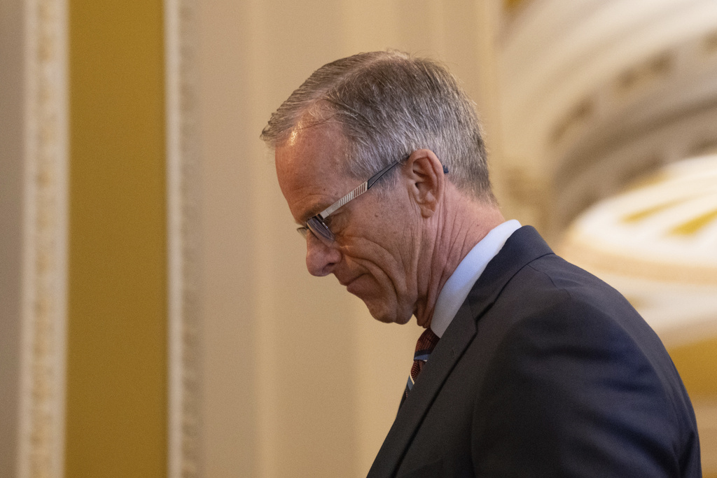 Senate Majority Leader John Thune, R-S.D., speaks to member of the media before voting at the Capitol on the ninth day of the government shutdown in Washington, Thursday, Oct. 9, 2025. (AP Photo/Allison Robbert)