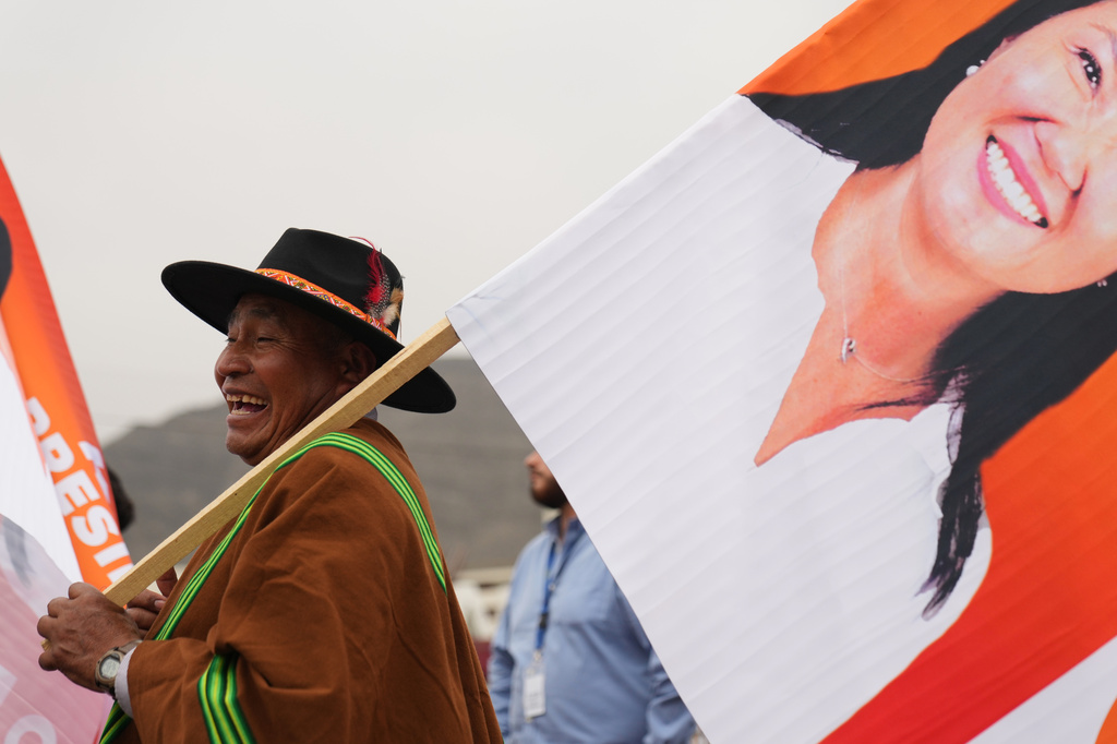 A supporters hols a banner of presidential candidate Keiko Fujimori during her closing campaign rally in Lima, Peru, Thursday, June 4, 2026. (AP Photo/Rodrigo Abd)