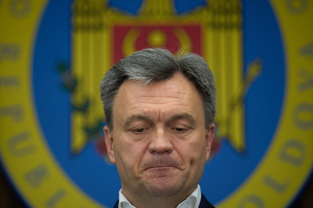 Moldova's Prime Minister Dorin Recean grimaces during statements on Russia's attempts to interfere in the country's upcoming Sept. 28 parliamentary elections in Chisinau, Moldova, Wednesday, Sept. 24, 2025. (AP Photo/Vadim Ghirda)