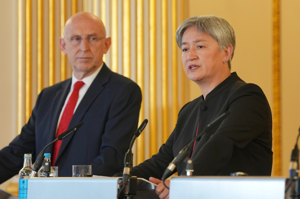 Britain's Defence Secretary John Healey listens Australia's Minister for Foreign Affairs Penny Wong at a press conference following the AUKMIN Summit, at Lancaster House in London, Wednesday, June 10, 2026. (AP Photo/Kin Cheung, Pool)