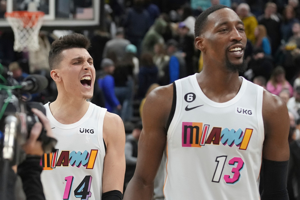 FILE - Miami Heat guard Tyler Herro (14) and center Bam Adebayo (13) celebrate Herro's game-winning shot at the end of the team' NBA basketball game against the Utah Jazz, Saturday, Dec. 31, 2022, in Salt Lake City. (AP Photo/George Frey, File)