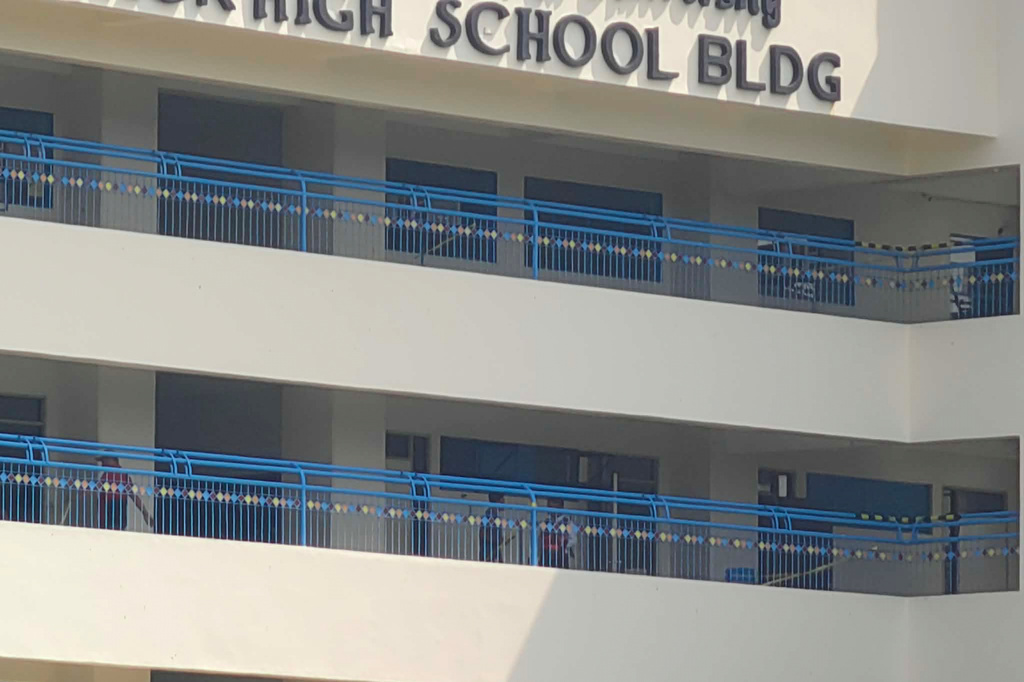 Police and security guards secure a junior high school building on the Ateneo de Zamboanga University campus following a shooting incident in Zamboanga, southern Philippines Tuesday, Aug. 18, 2026. (AP Photo)