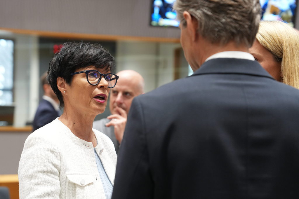 European Commissioner for Enlargement Marta Kos, left, speaks with Lithuania's Foreign Minister Kestutis Budrys, center, and European Union foreign policy chief Kaja Kallas, right, during a round table meeting of EU foreign ministers in Brussels, Monday, July 13, 2026. (AP Photo/Marius Burgelman)
