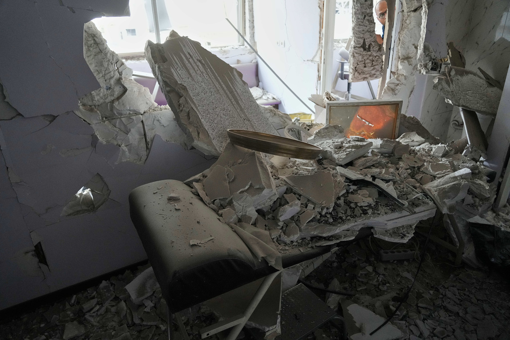 Debris is seen in a room of Gandhi Hospital, which was damaged when a strike hit a state TV communications tower and nearby buildings across the street during the ongoing joint U.S.-Israeli military campaign in Tehran, Iran, Monday, March 2, 2026. (AP Photo/Vahid Salemi)