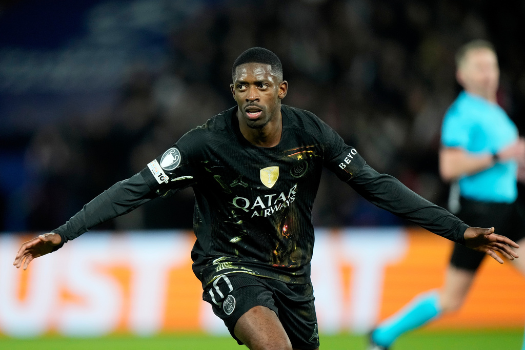 PSG's Ousmane Dembele celebrates after scoring his side's second goal during the first leg of the Champions League round of 16 soccer match between Paris Saint-Germain and Chelsea, in Paris, Wednesday, March 11, 2026. (AP Photo/Michel Euler)