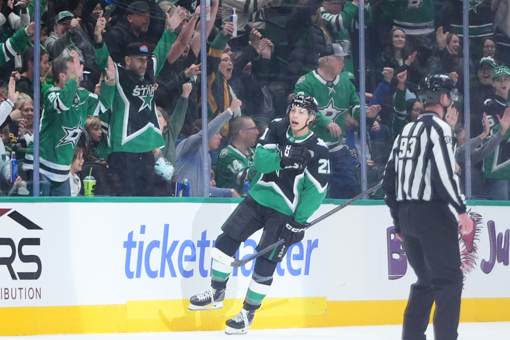 Dallas Stars left wing Jason Robertson (21) reacts to scoring a goal during the second period of an NHL hockey game against the Ottawa Senators, Sunday, Nov. 30, 2025, in Dallas. (AP Photo/LM Otero)