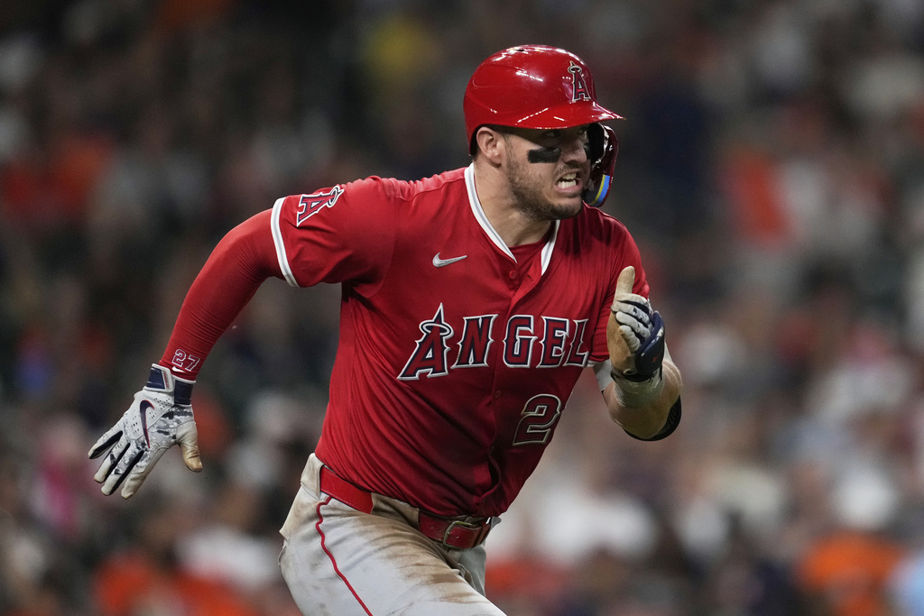 Los Angeles Angels designated hitter Mike Trout runs to first as he grounds out during the third inning of a baseball game against the Houston Astros in Houston, Sunday, Aug. 31, 2025. (AP Photo/Ashley Landis)