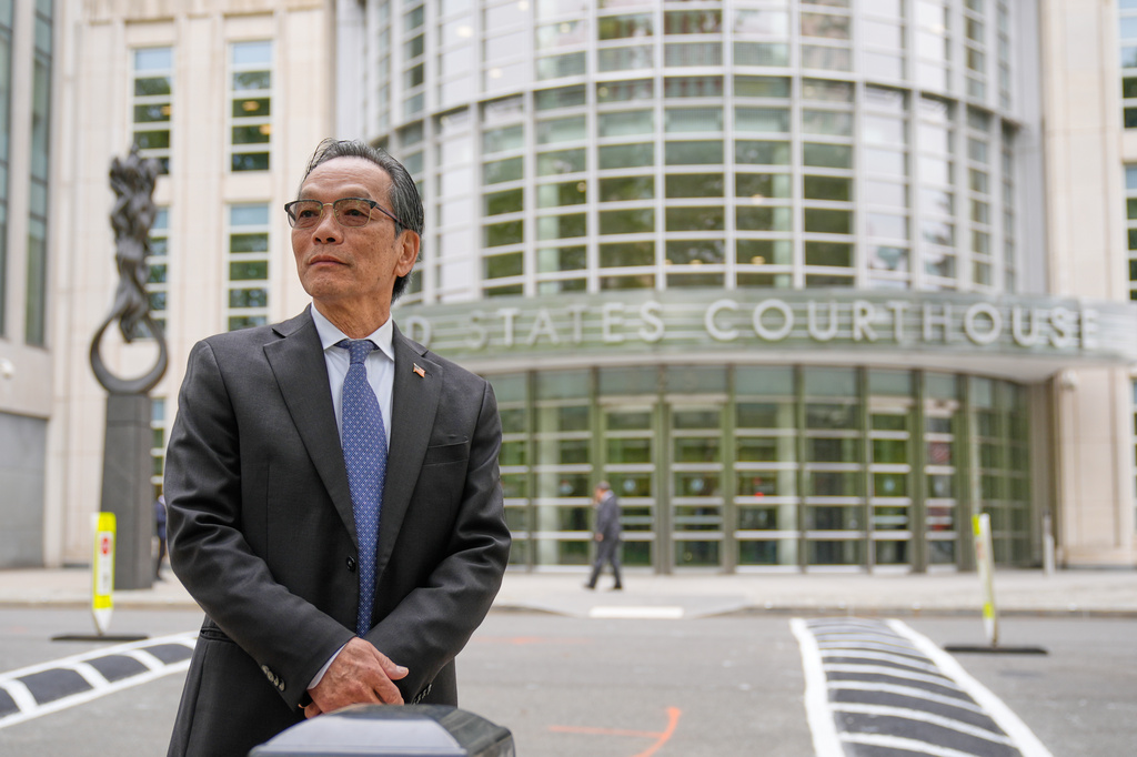 Lu Jianwang waits to enter a federal courthouse in New York, Wednesday, May 6, 2026. (AP Photo/Seth Wenig)