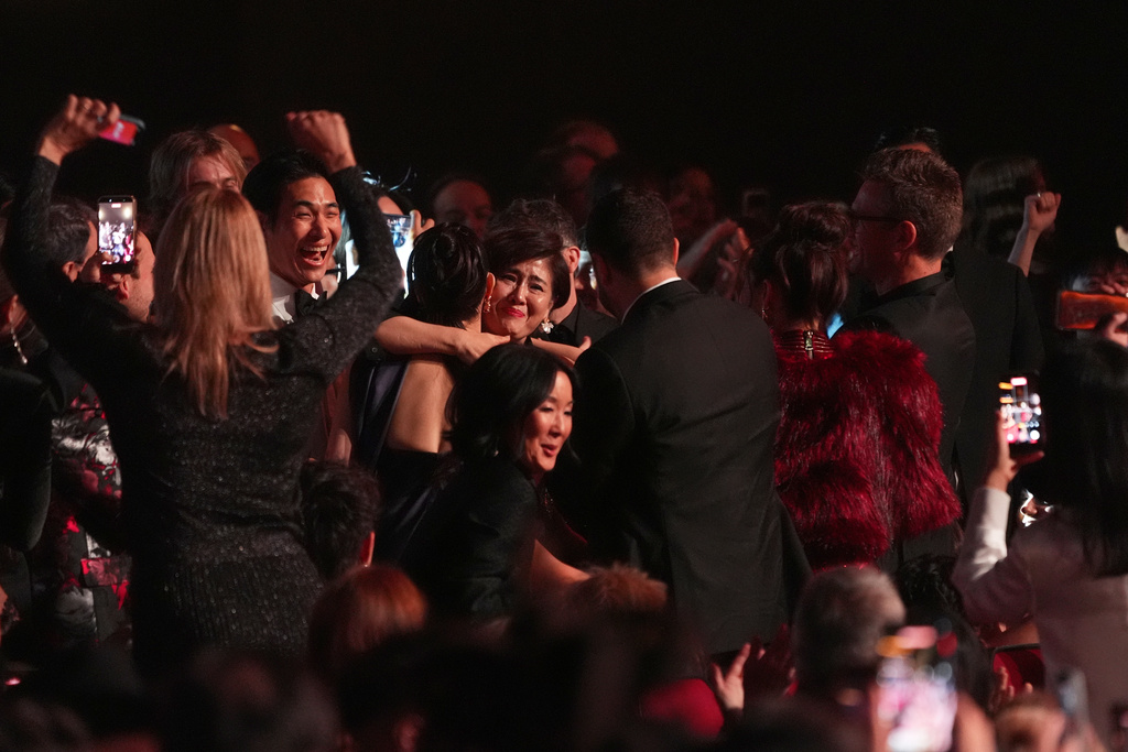 The team from KPop Demon Hunters react in the audience to winning the award for best song written for visual media for "Golden" during the 68th annual Grammy Awards on Sunday, Feb. 1, 2026, in Los Angeles. (AP Photo/Chris Pizzello)