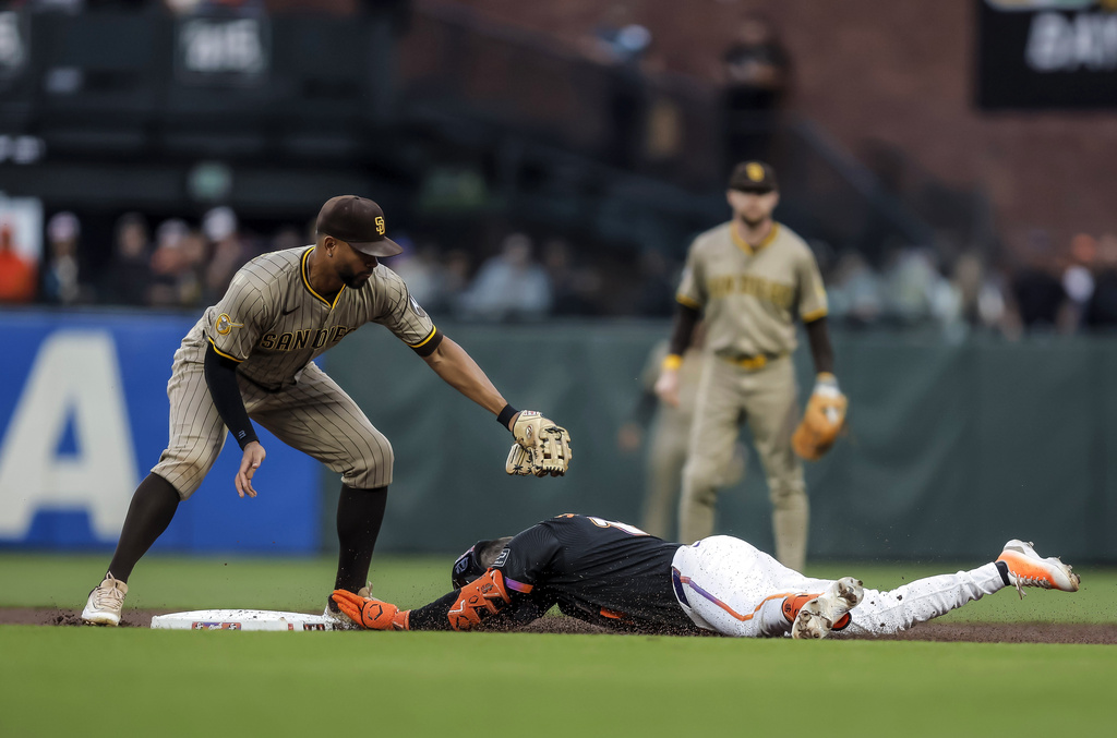 San Francisco Giants' Casey Scmitt (10) is safe at second on a double in the first inning of a baseball game against the San Diego Padres at Oracle Park in San Francisco, on Tuesday, Aug. 12, 2025.(Carlos Avila Gonzalez/San Francisco Chronicle via AP)