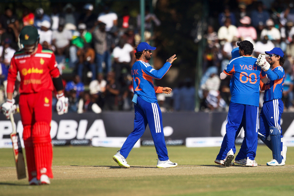 India's players celebrate the wicket of Zimbabwe's batsman Brian Bennett, left, during the second T20 cricket match between Zimbabwe and India in Harare, Zimbabwe, Saturday, July 25, 2026. (AP Photo/Wonder Mashura)