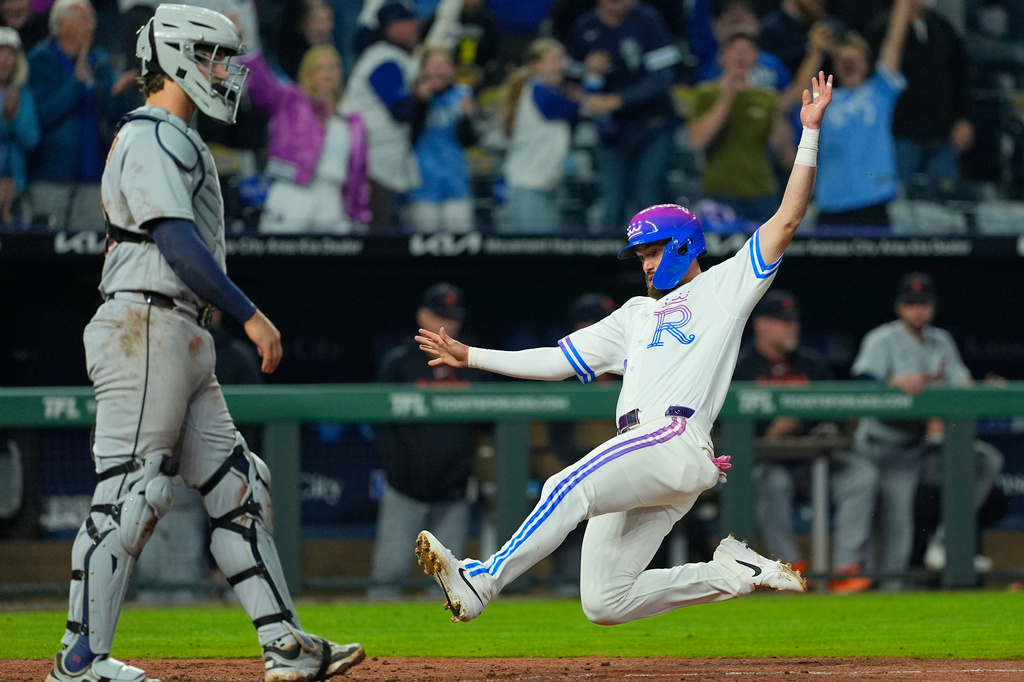 Kansas City Royals' Nick Loftin slides home to score the game-winning run on a single by Kyle Isbel during the ninth inning of a baseball game against the Detroit Tigers, Friday, May 8, 2026, in Kansas City, Mo. (AP Photo/Charlie Riedel)
