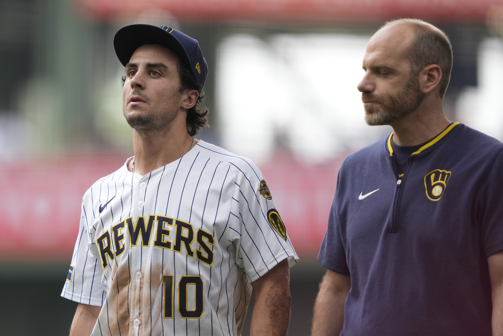 Milwaukee Brewers' Sal Frelick (10) walks to the dugout after suffering an injury during the third inning of a baseball game against the Washington Nationals, Sunday, July 13, 2025, in Milwaukee. (AP Photo/Aaron Gash)