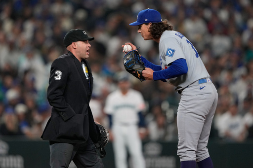 Los Angeles Dodgers starting pitcher Tyler Glasnow, right, talks to umpire Dan Merzel during the third inning of a baseball game, Saturday, Sept. 27, 2025, in Seattle. (AP Photo/Ryan Sun) Los Angeles Dodgers starting pitcher Tyler Glasnow, right, talks to umpire Dan Merzel during the third inning of a baseball game, Saturday, Sept. 27, 2025, in Seattle. (AP Photo/Ryan Sun)