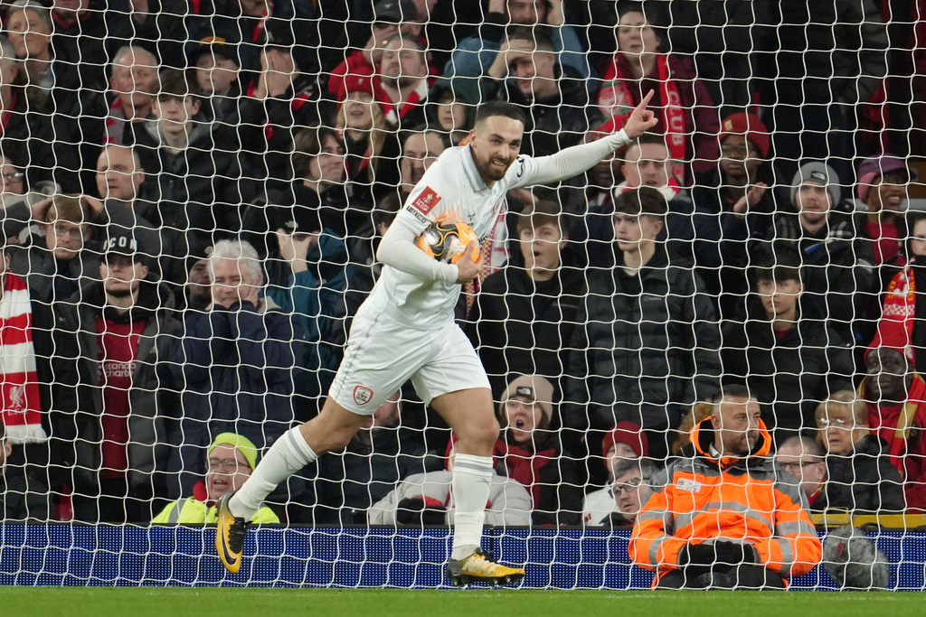 Barnsley's Adam Phillips celebrates after scoring during the FA Cup third round soccer match between Liverpool and Barnsley in Liverpool, England, Monday, Jan. 12, 2026. (AP Photo/Jon Super)