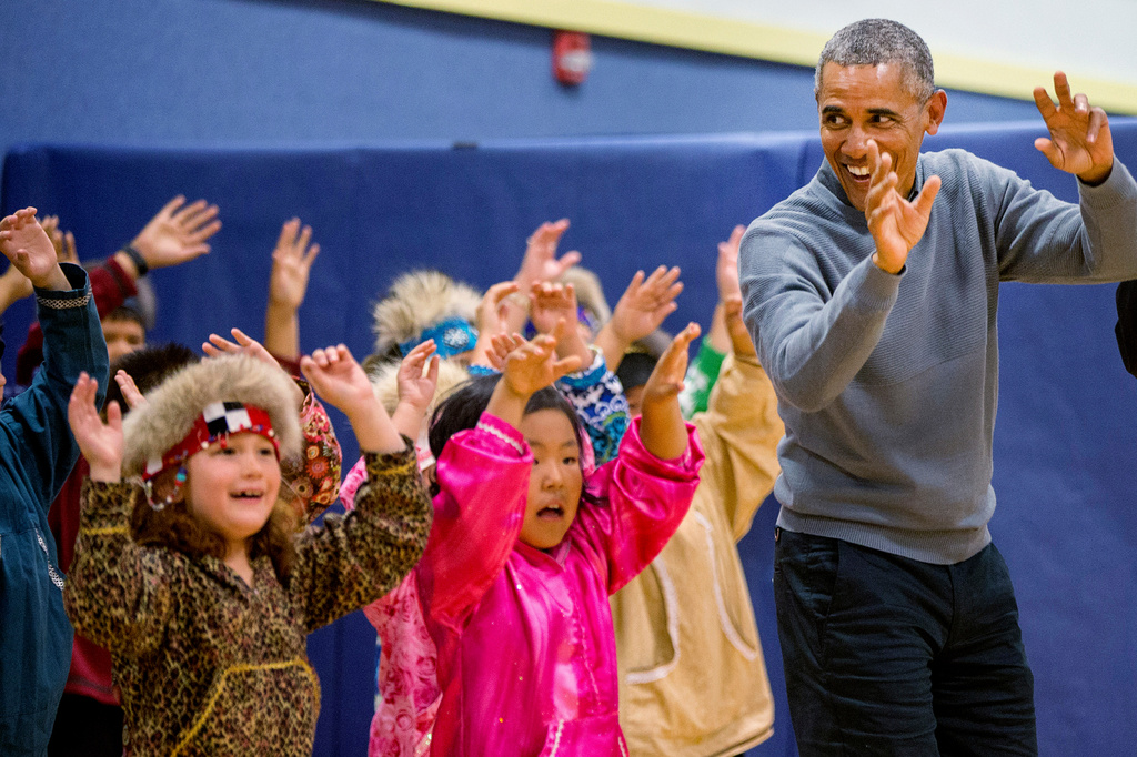 FILE - President Barack Obama participates in a performance by native Alaskan dancers at Dillingham Middle School, Wednesday, Sept. 2, 2015, in Dillingham, Alaska. (AP Photo/Andrew Harnik,File)