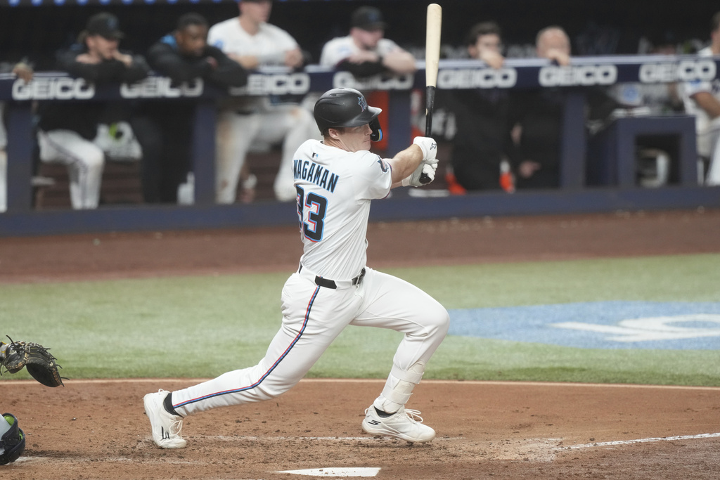 Miami Marlins first baseman Eric Wagaman (33) hits a single to right field during the sixth inning of a baseball game against the Washington Nationals Wednesday, Sept. 10, 2025, in Miami. (AP Photo/Marta Lavandier)