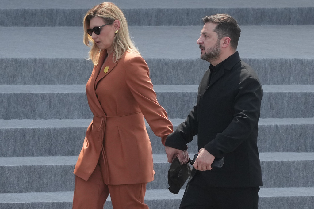Ukraine's President Volodymyr Zelensky and his wife Olena Zelenska leave after the Bastille Day military parade on the Champs-Elysees avenue, in Paris, Tuesday, July 14, 2026. (AP Photo/Michel Euler)