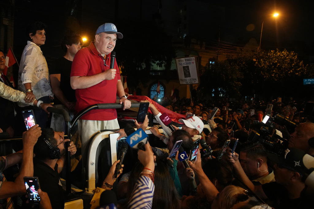 Rafael Lopez Aliaga, presidential candidate of the Popular Renewal party, speaks to supporters as electoral authorities continue to count the ballots two days after general elections in Lima, Peru, Tuesday, April 14, 2026. (AP Photo/Guadalupe Pardo)