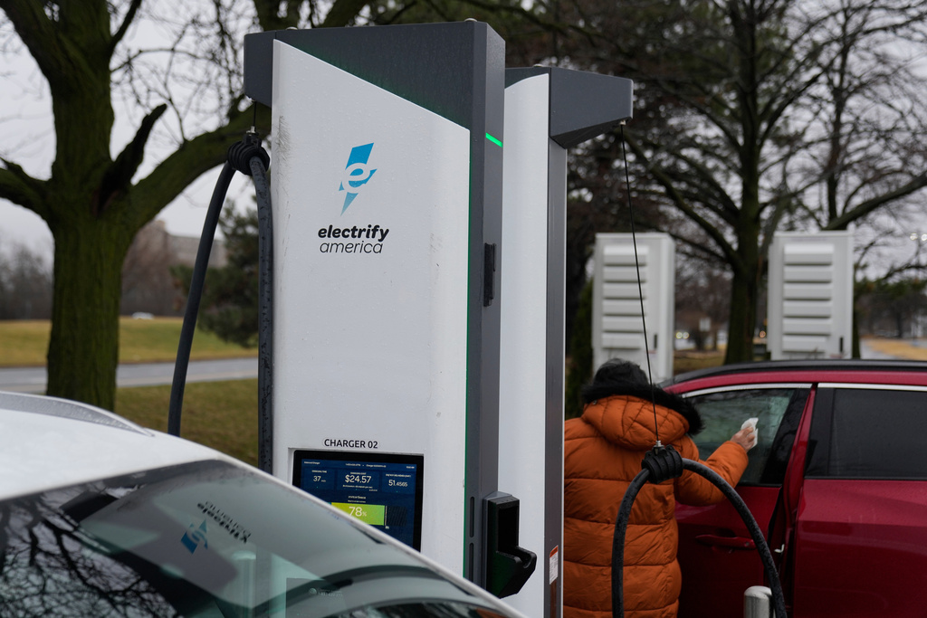 Electric vehicles charge at a station Wednesday, March 11, 2026, in Lincolnwood, Ill. (AP Photo/Erin Hooley)