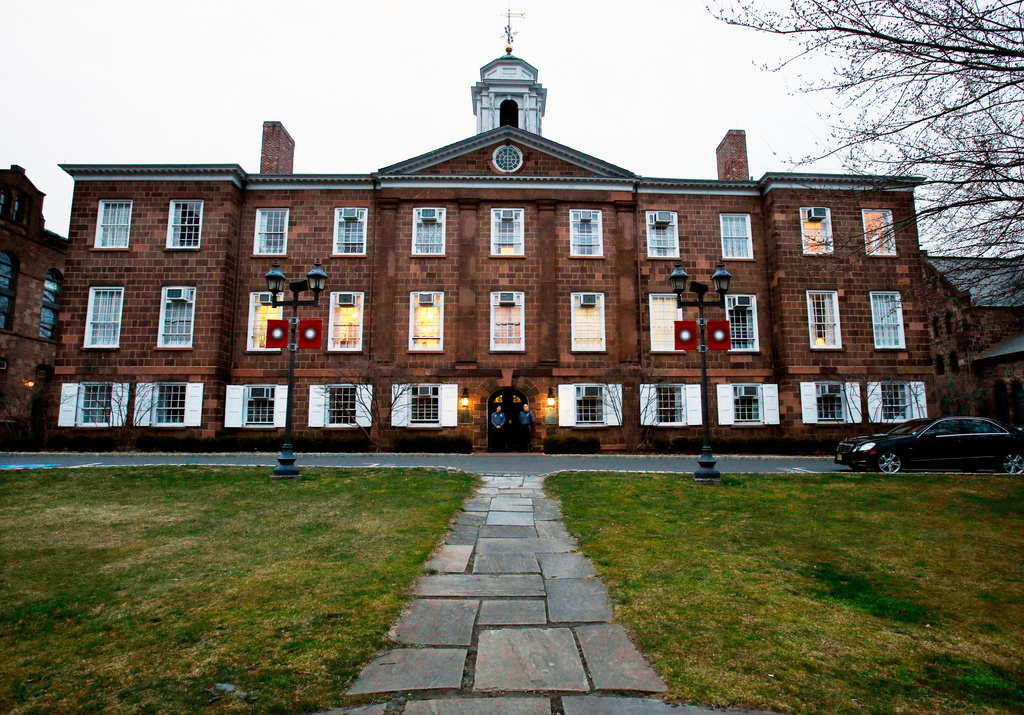 FILE - Lights glow in Rutgers University's Old Queens building, April 4, 2013, in New Brunswick, N.J. (AP Photo/Mel Evans, File)