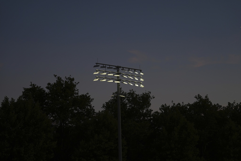 Shielded LED lights, approved by DarkSky International, illuminate a court during the U.S. Open tennis tournament at the USTA Billie Jean King National Tennis Center in New York, on Monday, Aug. 18, 2025. (AP Photo/Mary Conlon)
