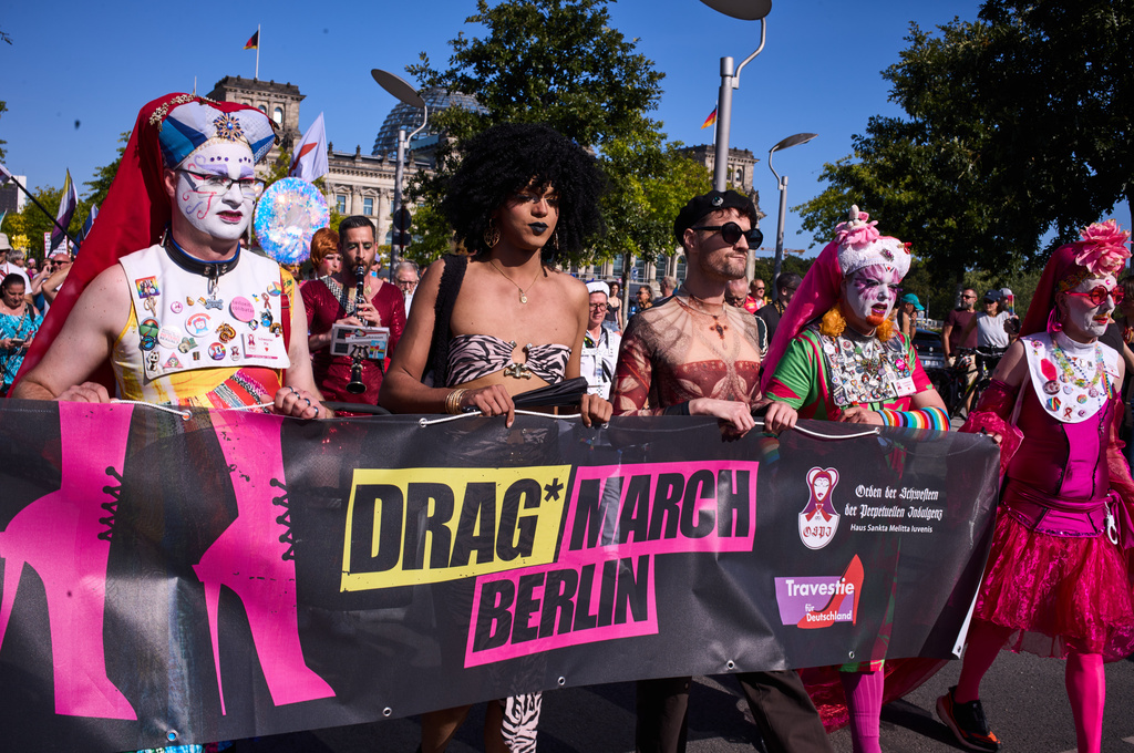 Sisters Pia, left, Sister Daphne, second right, and Sister Clementia, right, of the German chapter OSPI of the Sisters of Perpetual Indulgence, SPI, attend the first Berlin Drag March on the eve of the Pride March in Berlin, Germany, Friday, July 24, 2026. (AP Photo/Markus Schreiber)