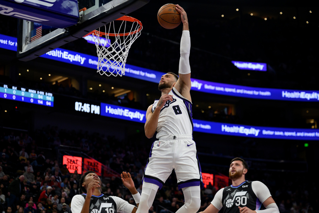 Sacramento Kings guard Zach LaVine (8) goes up to dunk the ball during the first half of an NBA Cup basketball game against the Utah Jazz, Friday, Nov. 28, 2025, in Salt Lake City. (AP Photo/Tyler Tate)