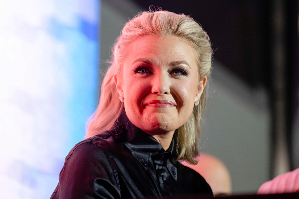 Erika Kirk smiles at a question and answer session during Turning Point USA's AmericaFest 2025, Friday, Dec. 19, 2025, in Phoenix. (AP Photo/Jon Cherry)