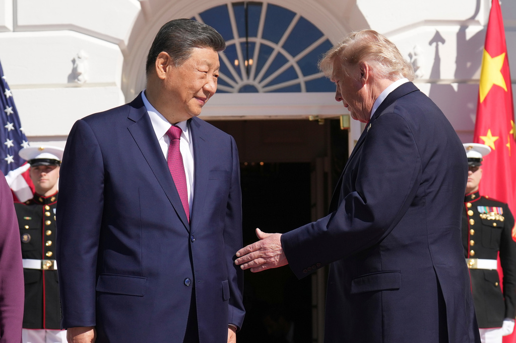 President Donald Trump, right, greets China's President Xi Jinping upon arrival at the South Portico of the White House, Friday, Sept. 25, 2026, in Washington. (AP Photo/Jacquelyn Martin)