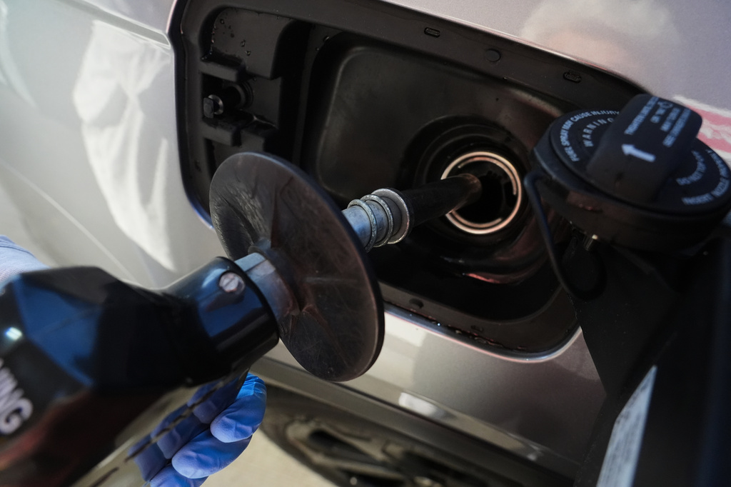 A motorist fills up the vehicle's gas tank at a gas station in Buffalo Grove, Ill., Monday, June 8, 2026. (AP Photo/Nam Y. Huh)